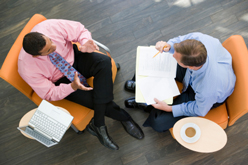 Overhead view of two businessmen having a meeting