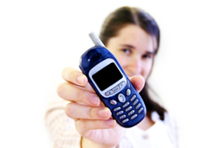 Young woman holds out mobile phone