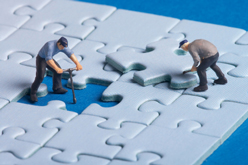 Workers fixing a puzzle